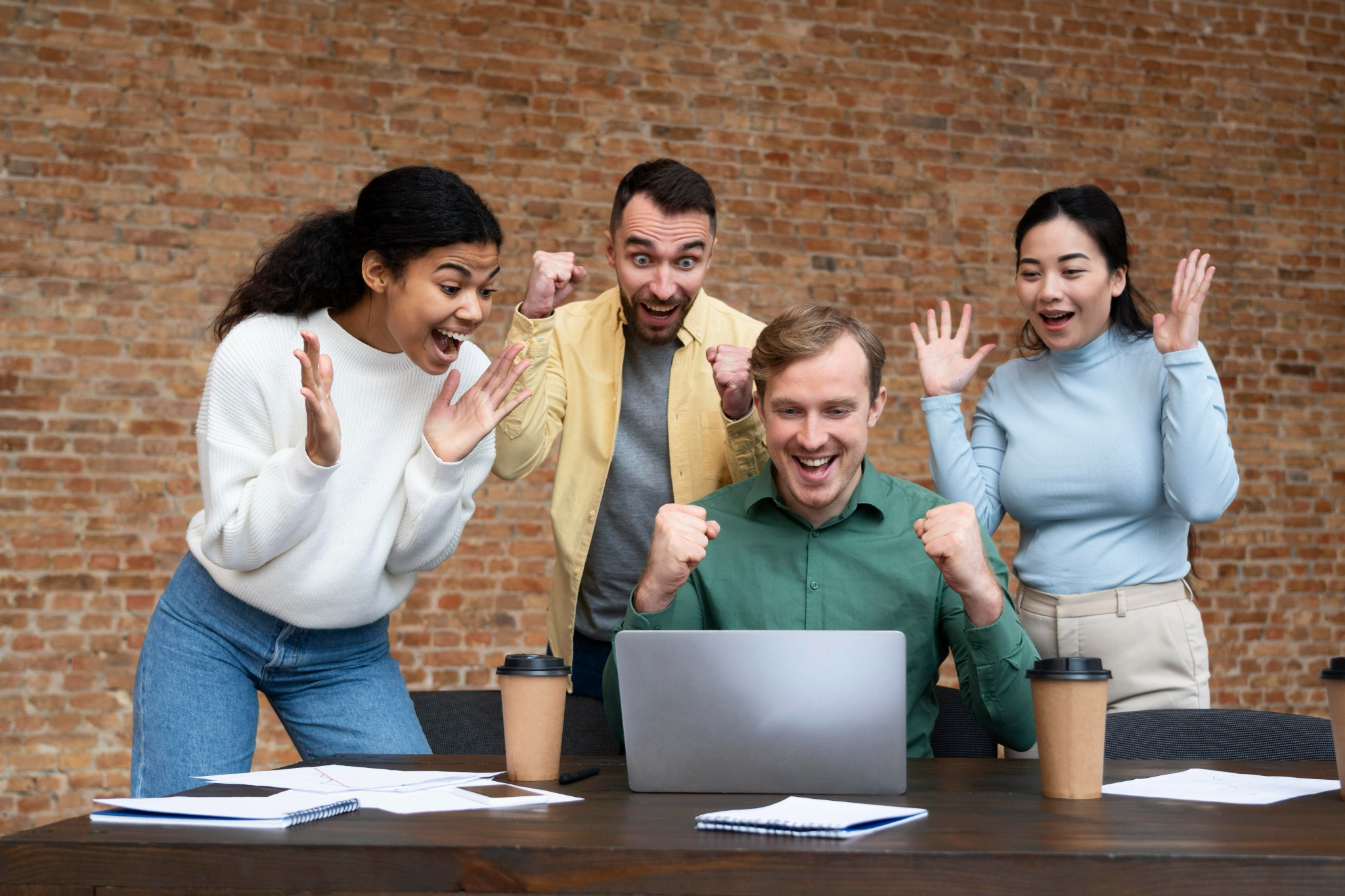 Team gathered around a table brainstorming together